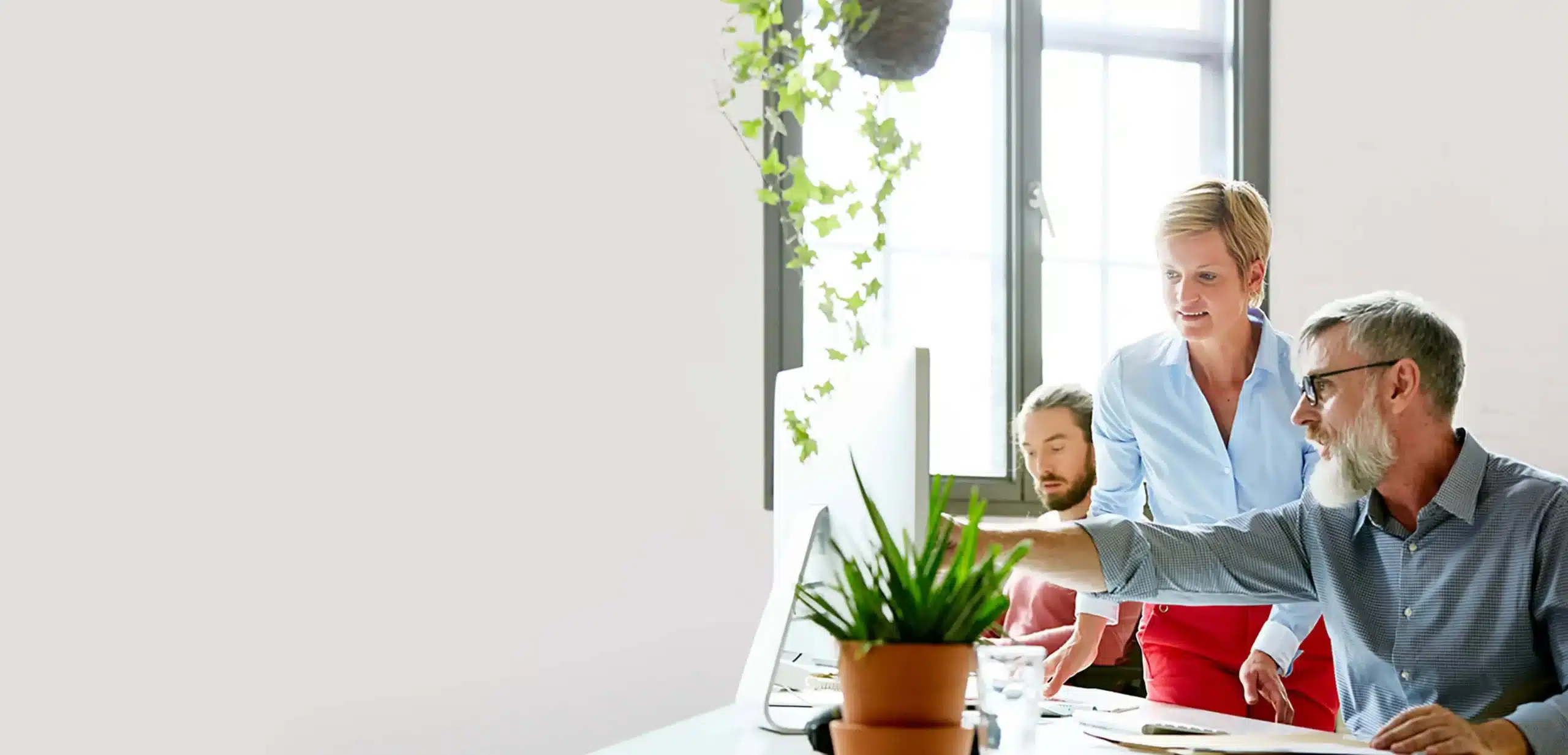 Man Pointing at Computer